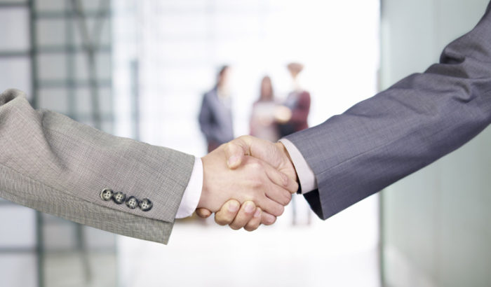 businesspeople shaking hands.